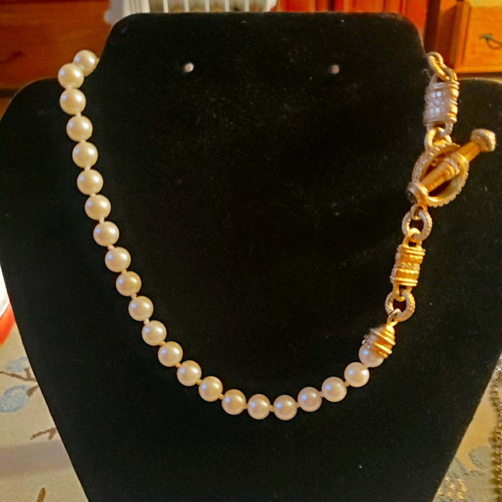 Vintage pearl necklace with ornate brass clasp